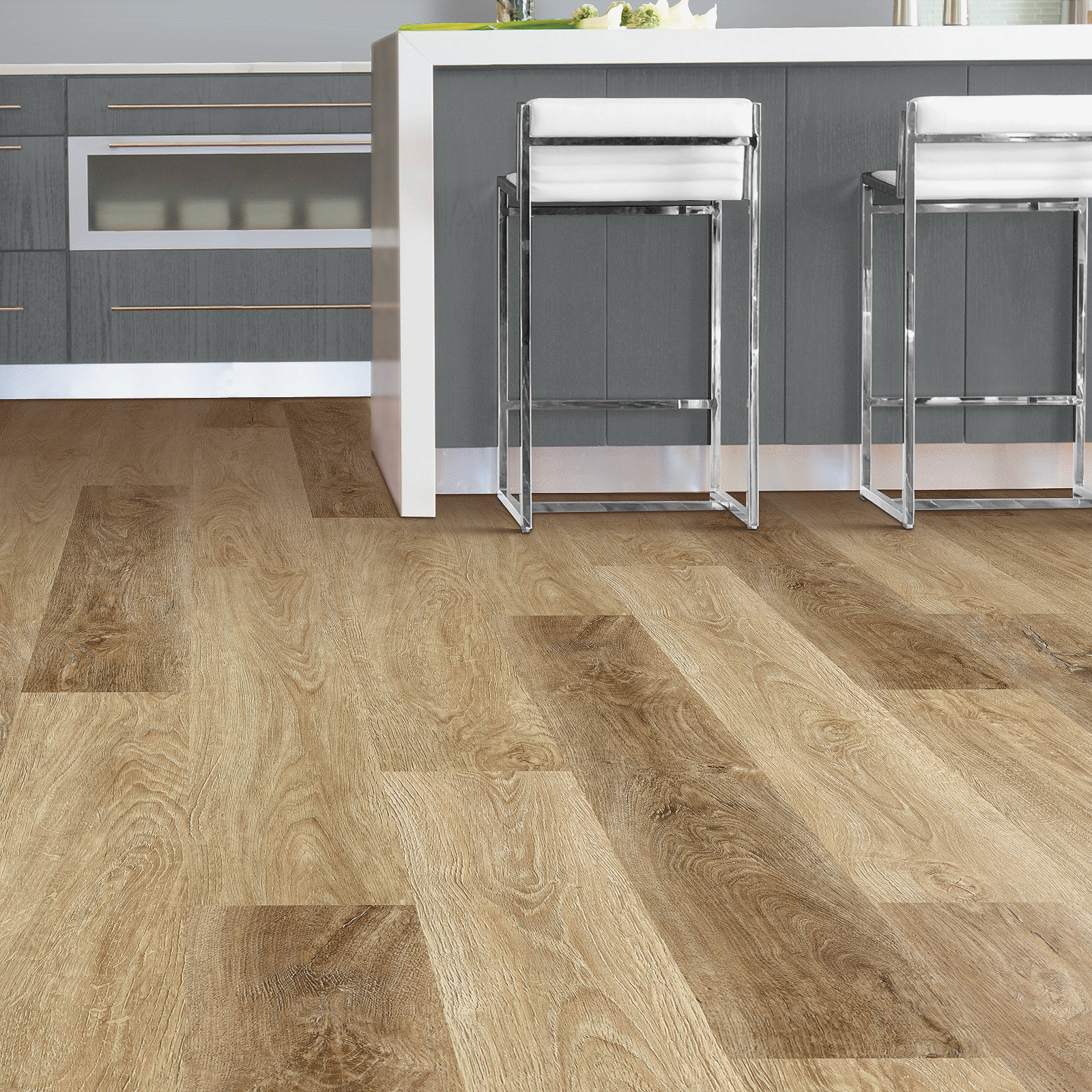 A kitchen with wood flooring and grey cabinets.