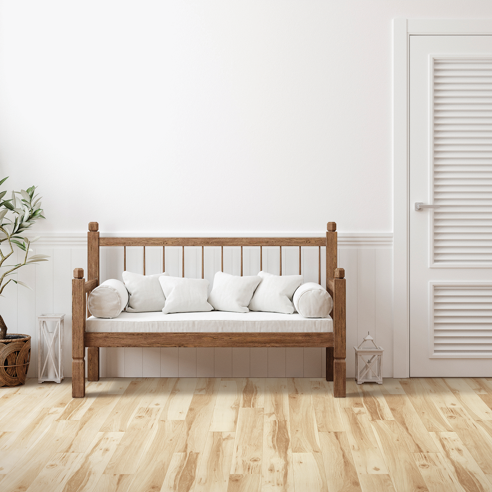 A wooden bench with pillows in front of a white wall.