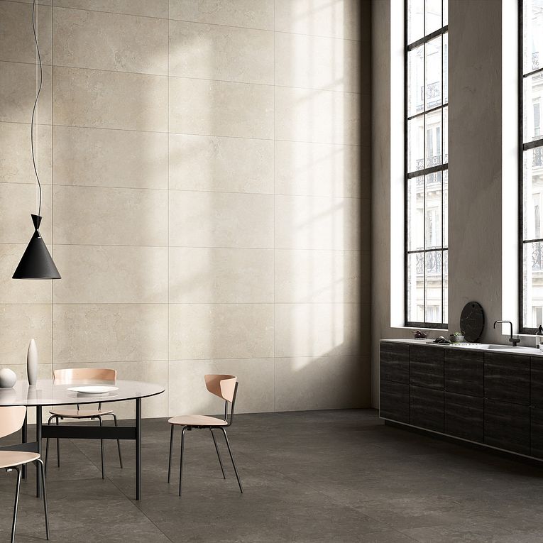 A room with two windows and three tables