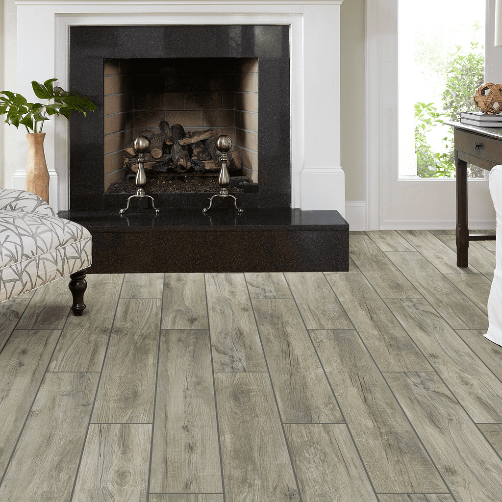 A living room with a fireplace and wooden floors