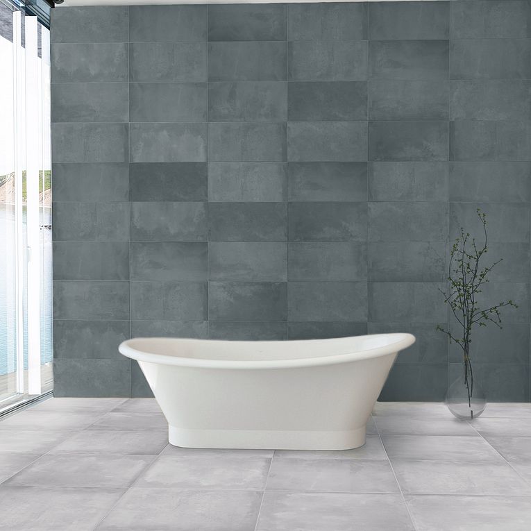 A white tub sitting in front of a window.