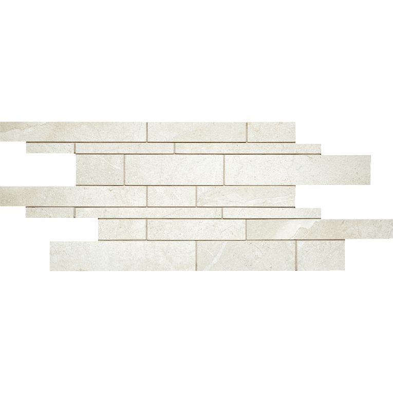 A white brick wall with some small bricks