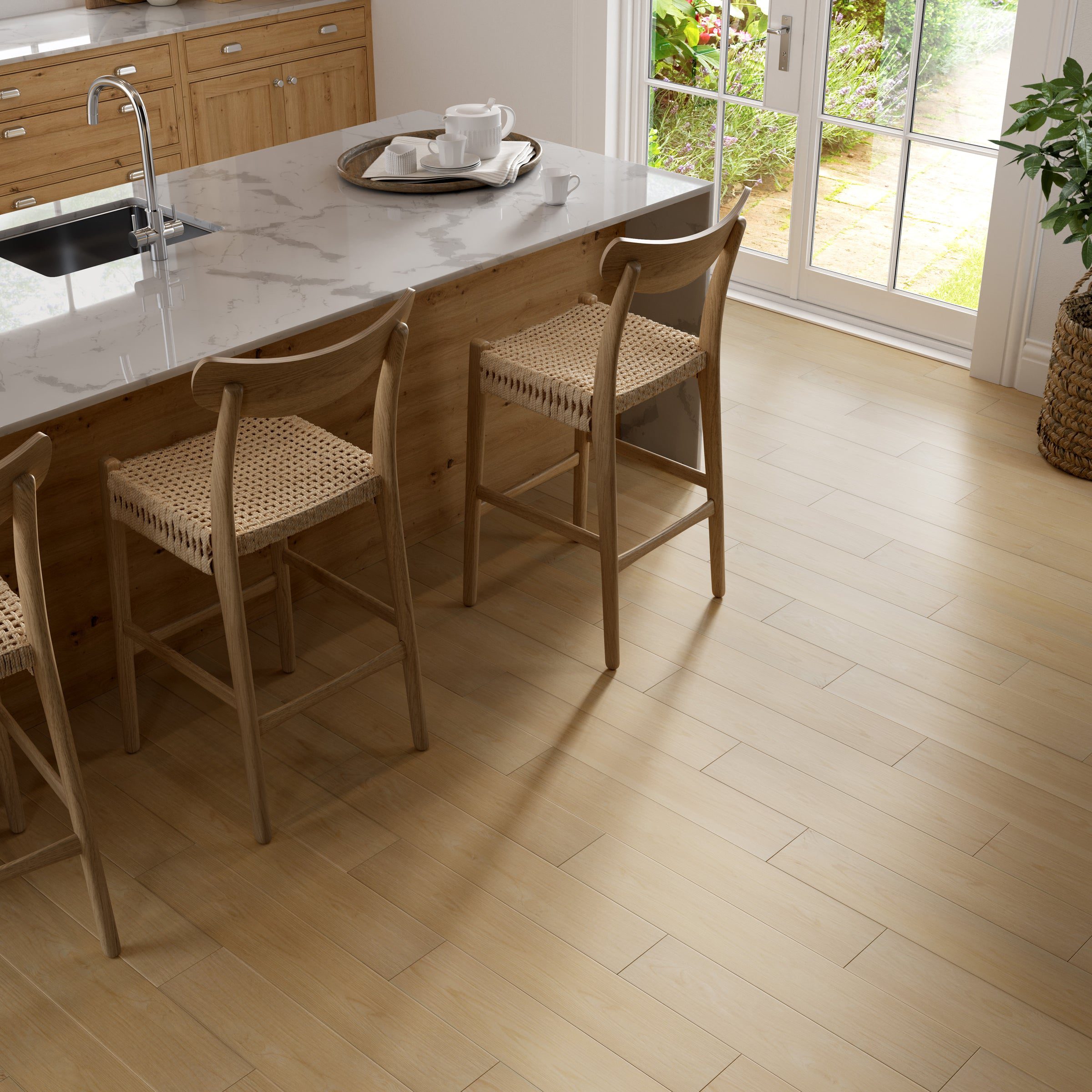 A kitchen with wooden floors and white walls.