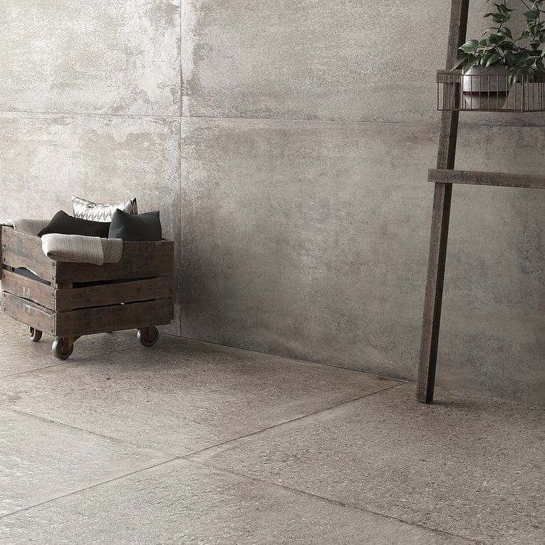 A room with concrete walls and cement floors.