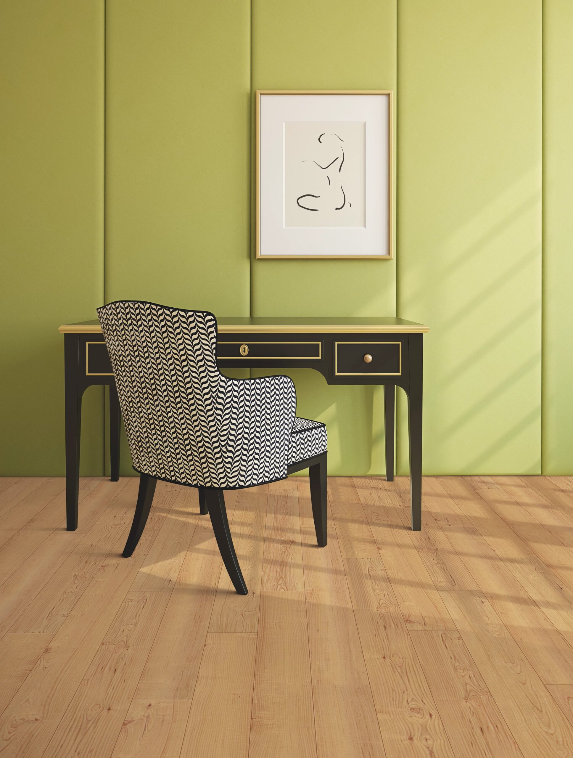 A chair and desk in front of a green wall.