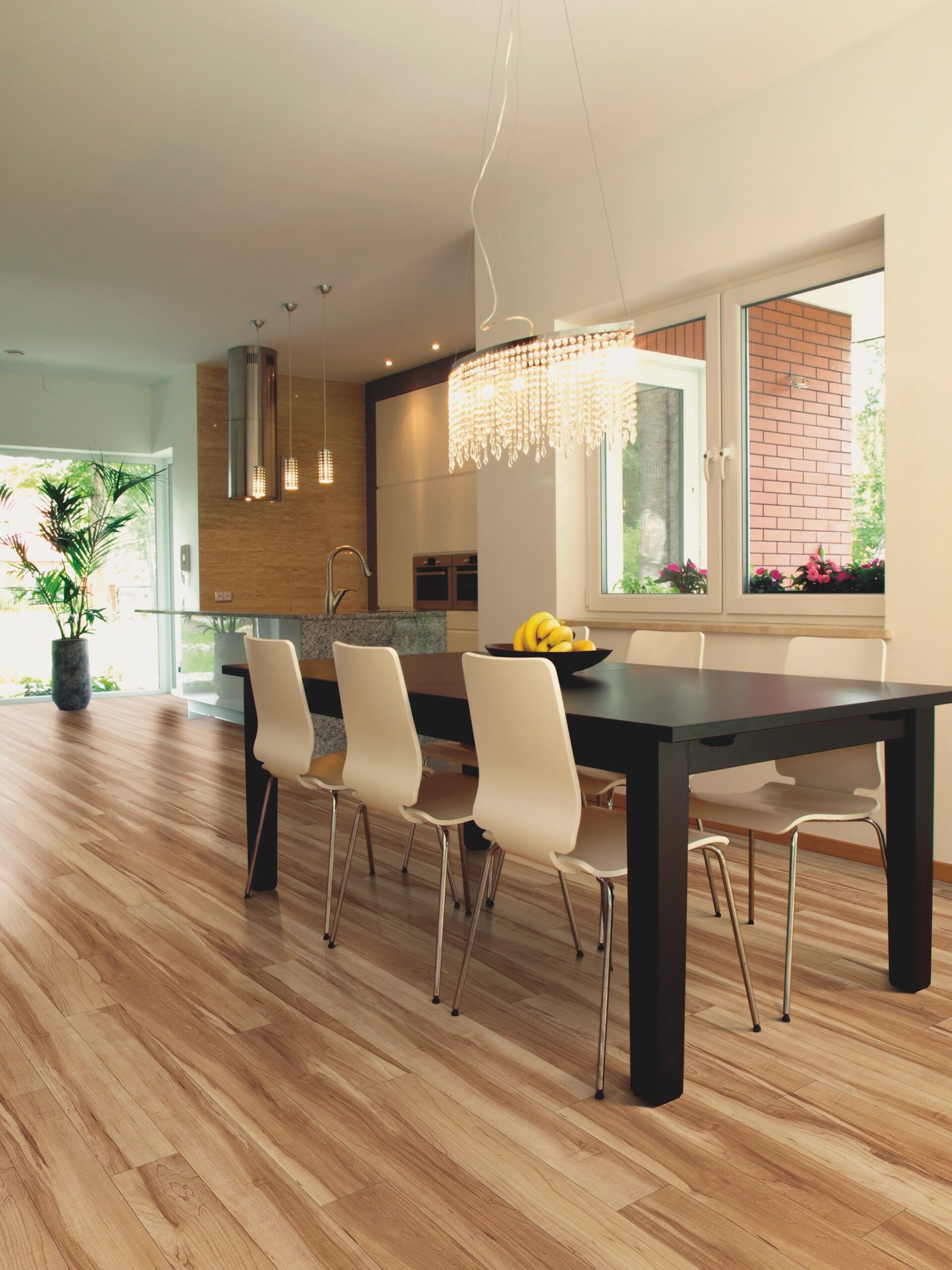 A dining room table with four chairs in it.