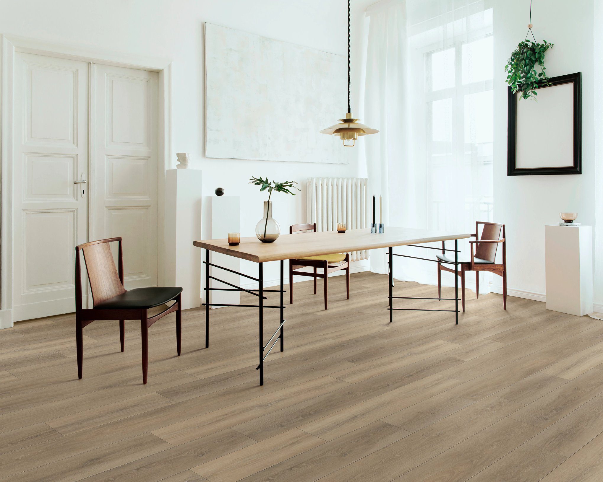 A dining room with two chairs and a table