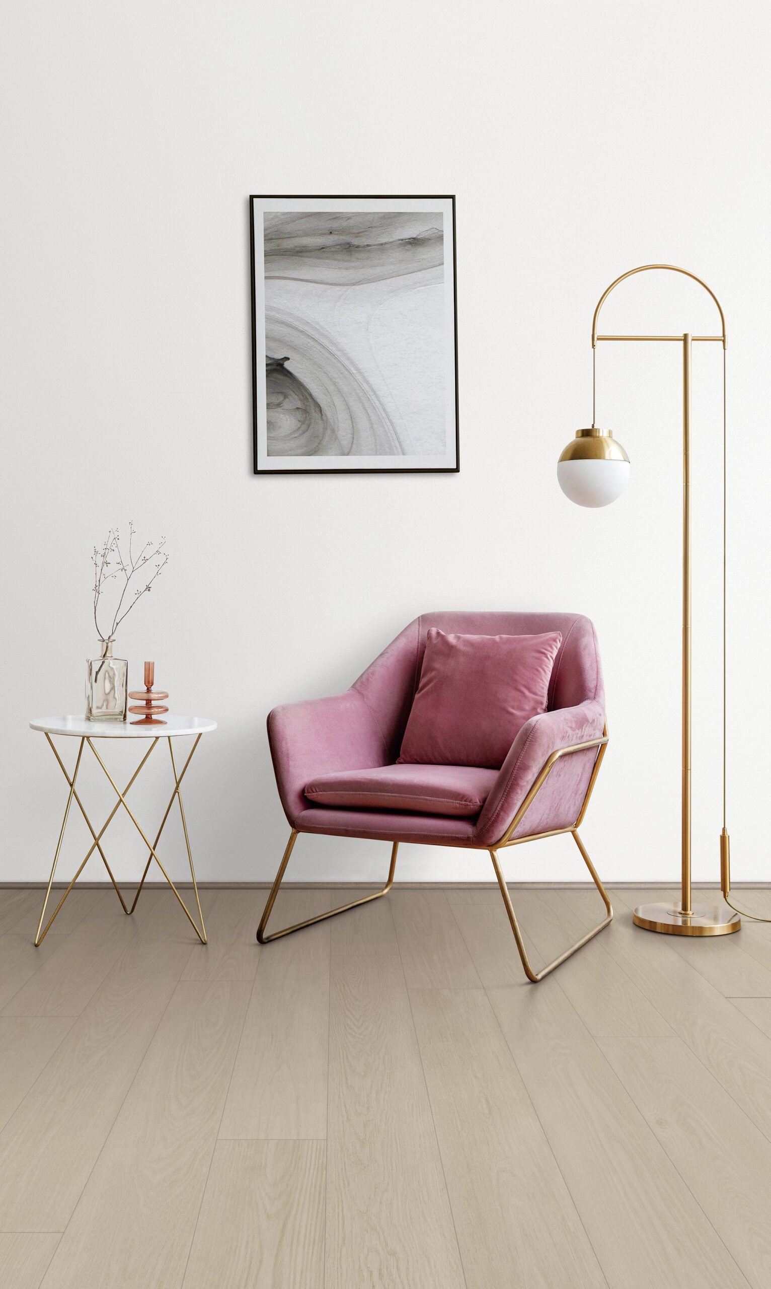 A pink chair and table in a room.