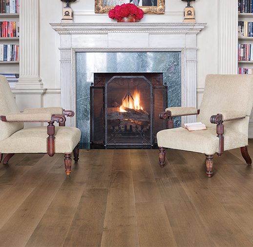A fireplace in the center of a living room.