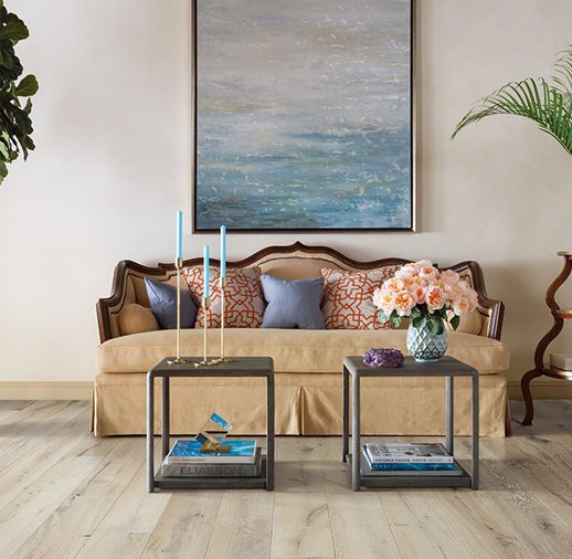 A living room with two tables and a couch