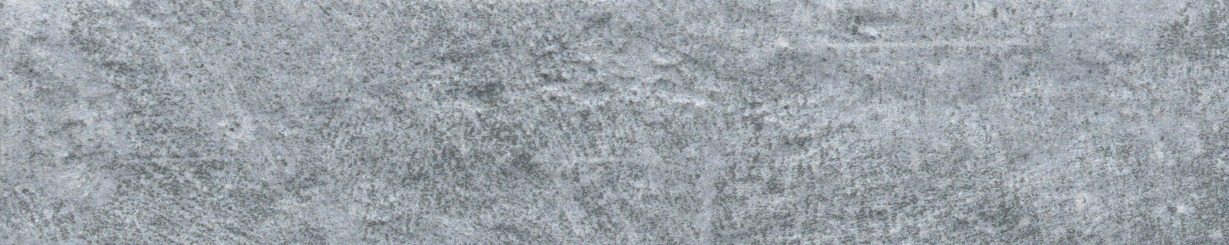 A close up of the ground surface of a stone wall.