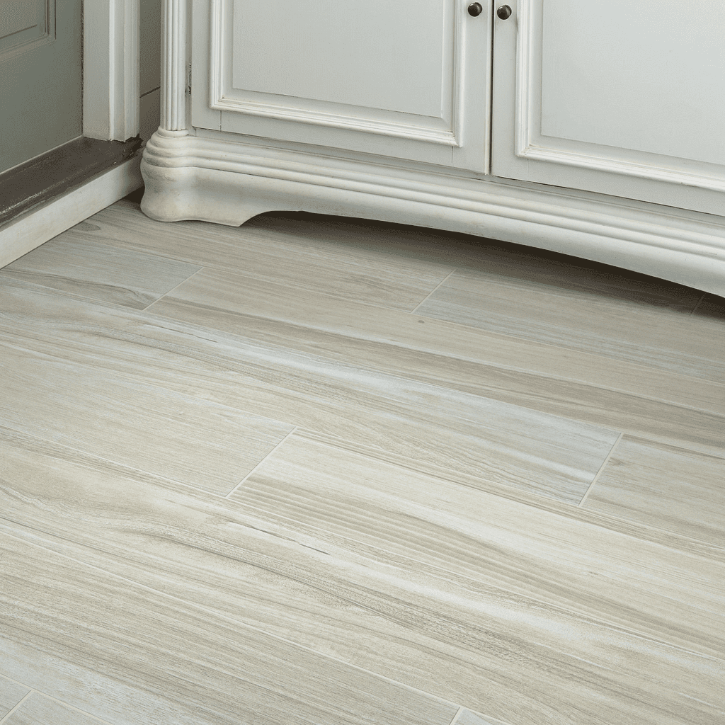 A white kitchen with wooden floors and cabinets.