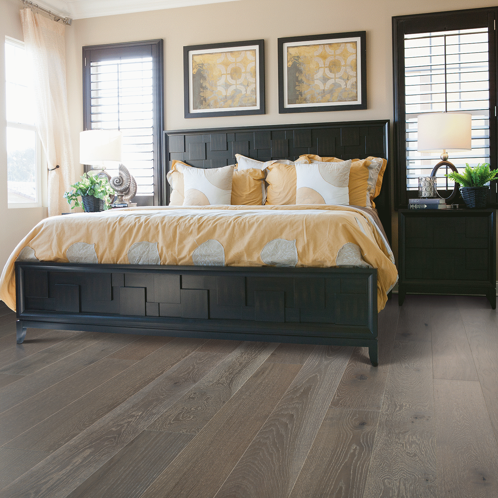 A bedroom with a bed and two nightstands.