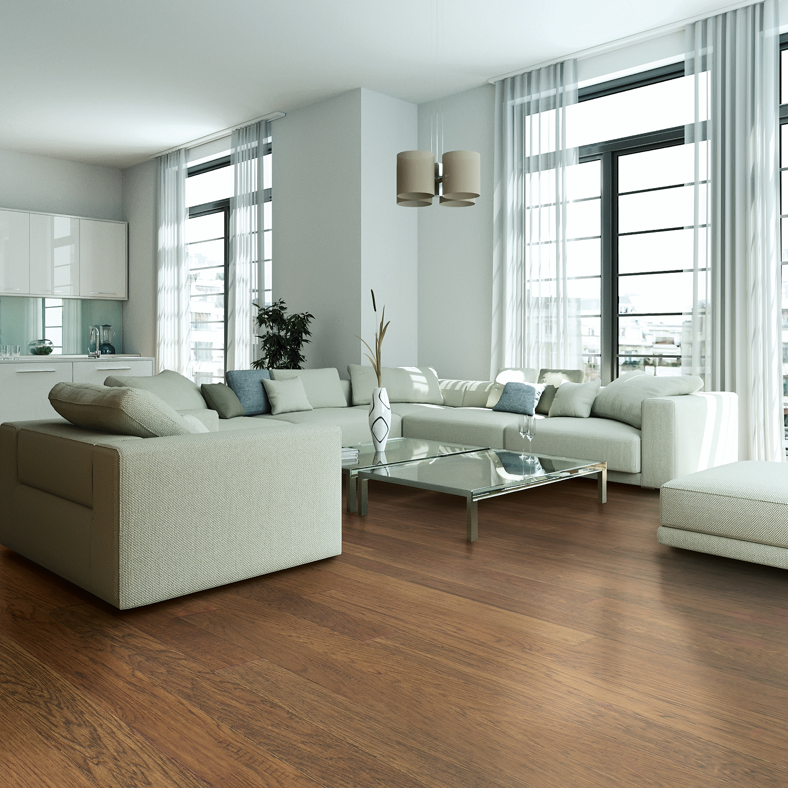 A living room with white furniture and large windows.