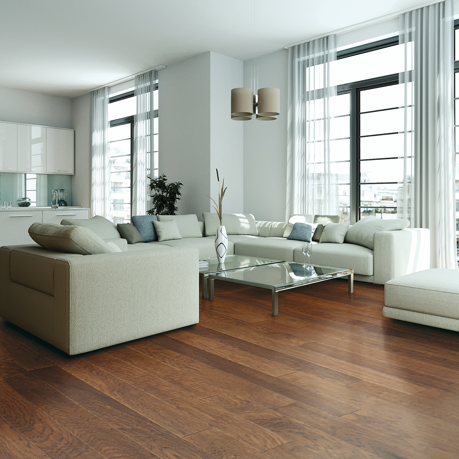 A living room with white furniture and large windows.