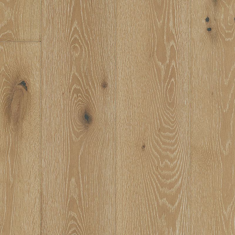 A close up of the floor of a room with wood.