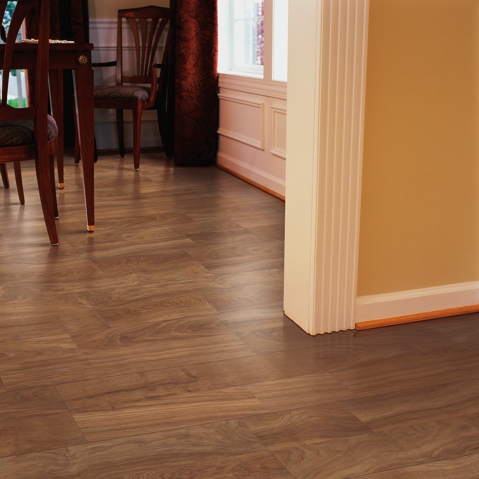 A room with wooden floors and chairs.