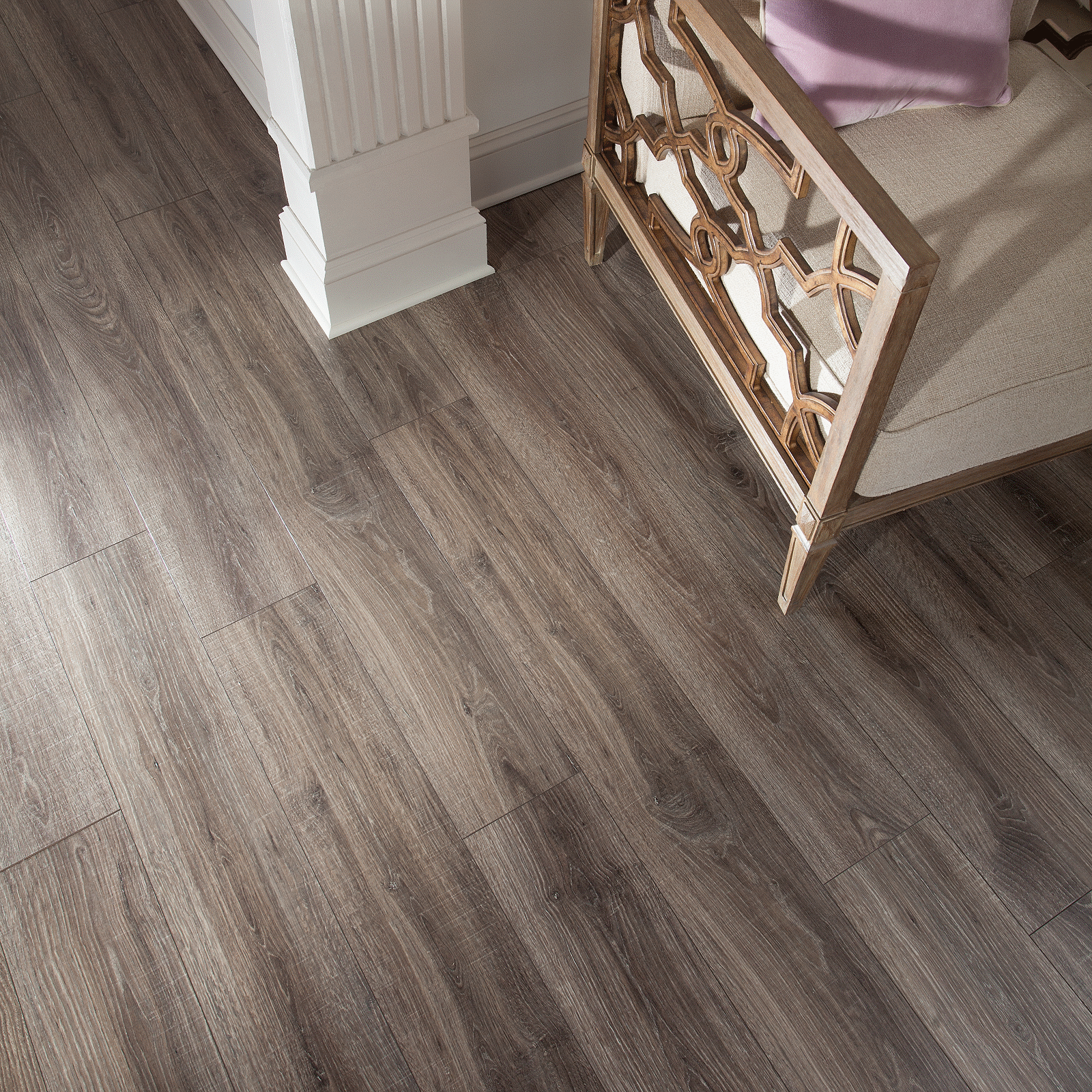 A room with wood floors and a chair.