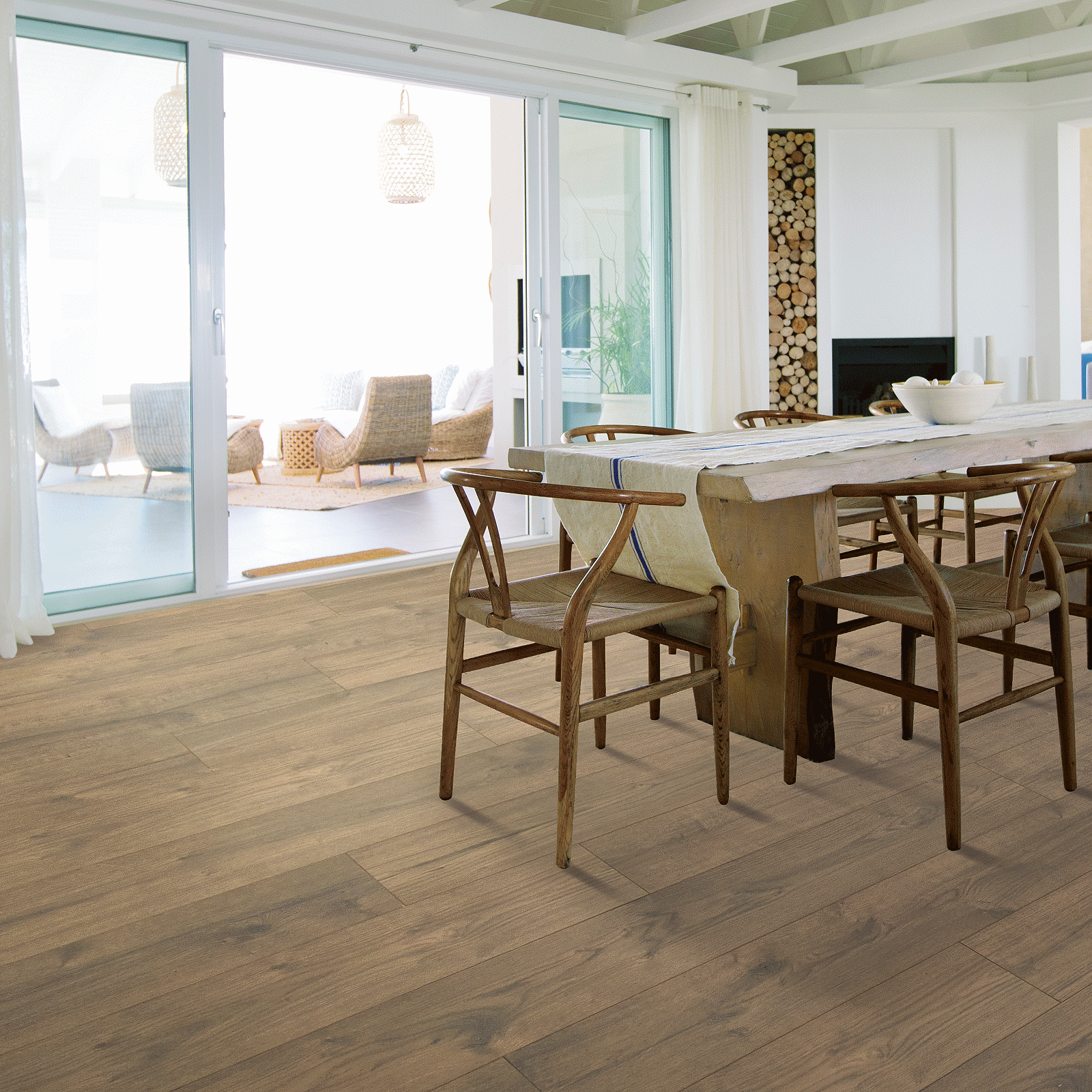 A dining room with a table and chairs