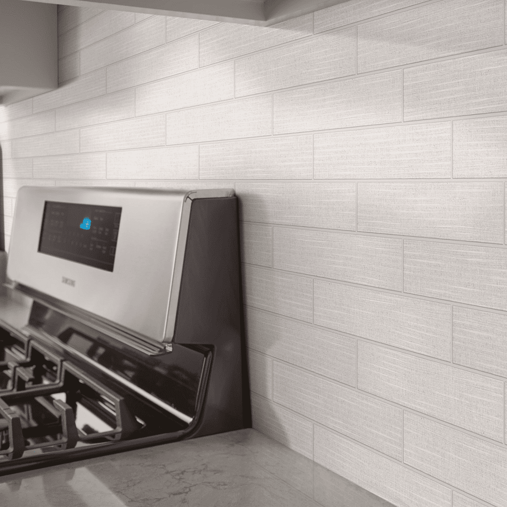 A stove with the oven on in front of it.