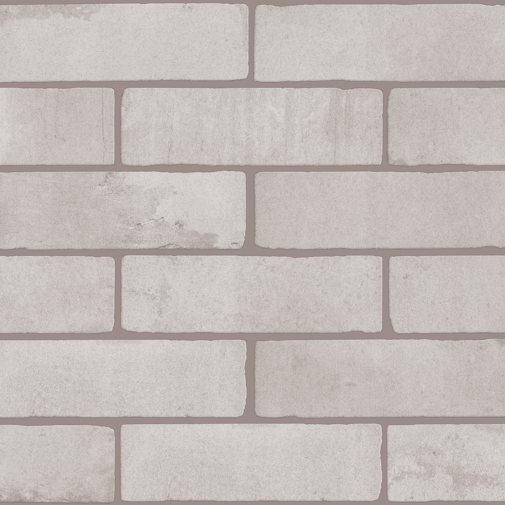 A white brick wall with some gray paint
