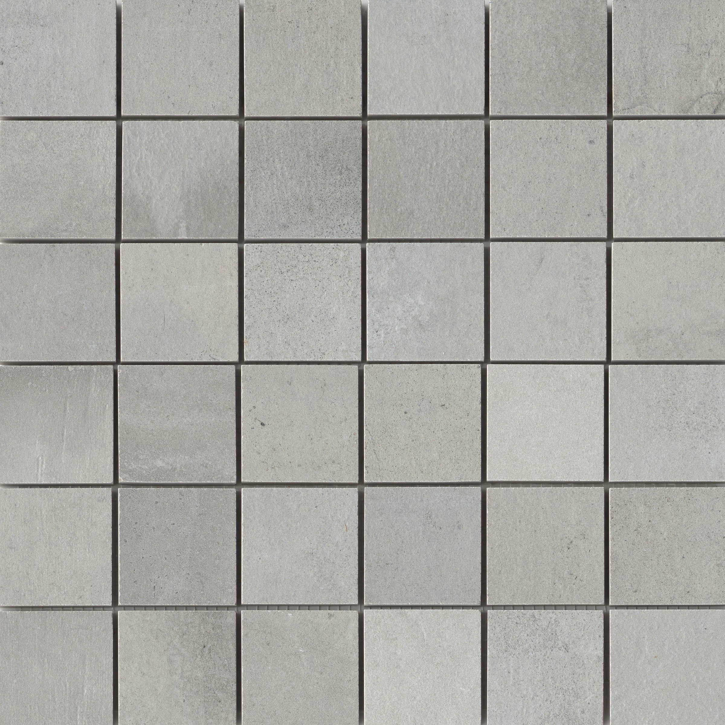A square tile pattern that is gray and has some type of design.