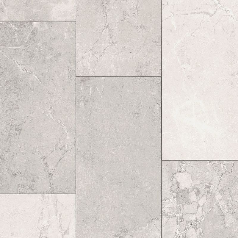 A white tile floor with different shades of grey.