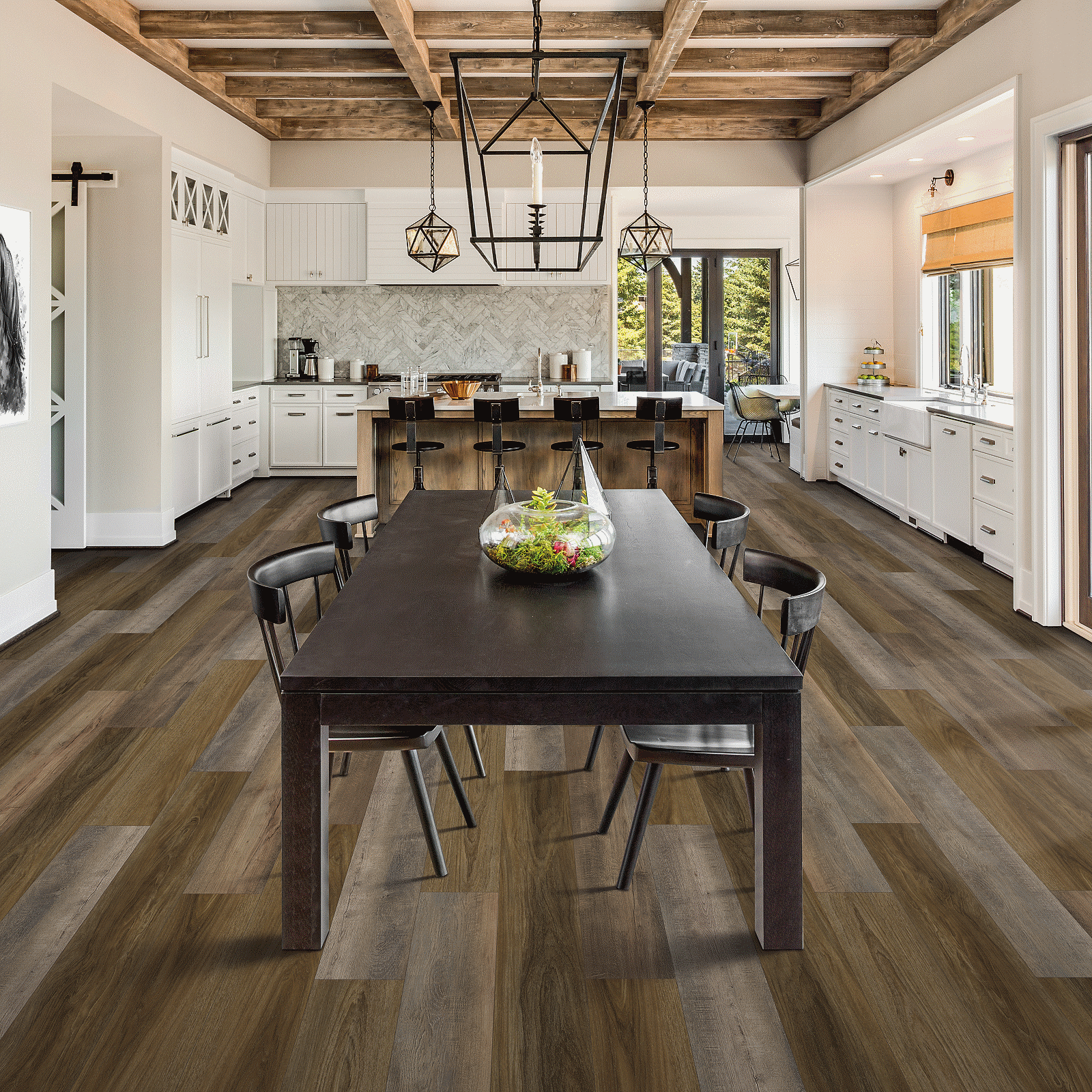 A kitchen with a table and chairs in it