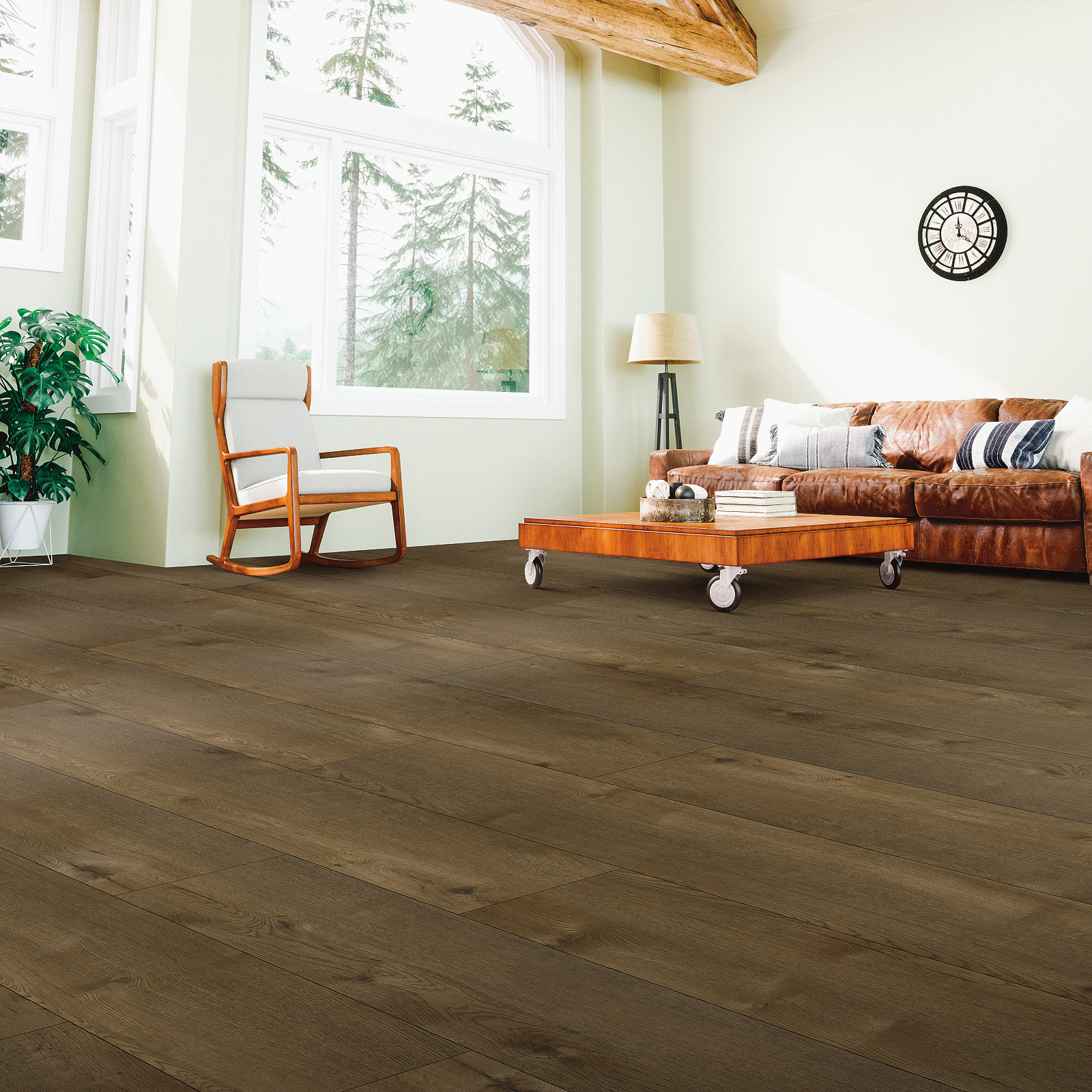 A living room with hard wood floors and furniture.