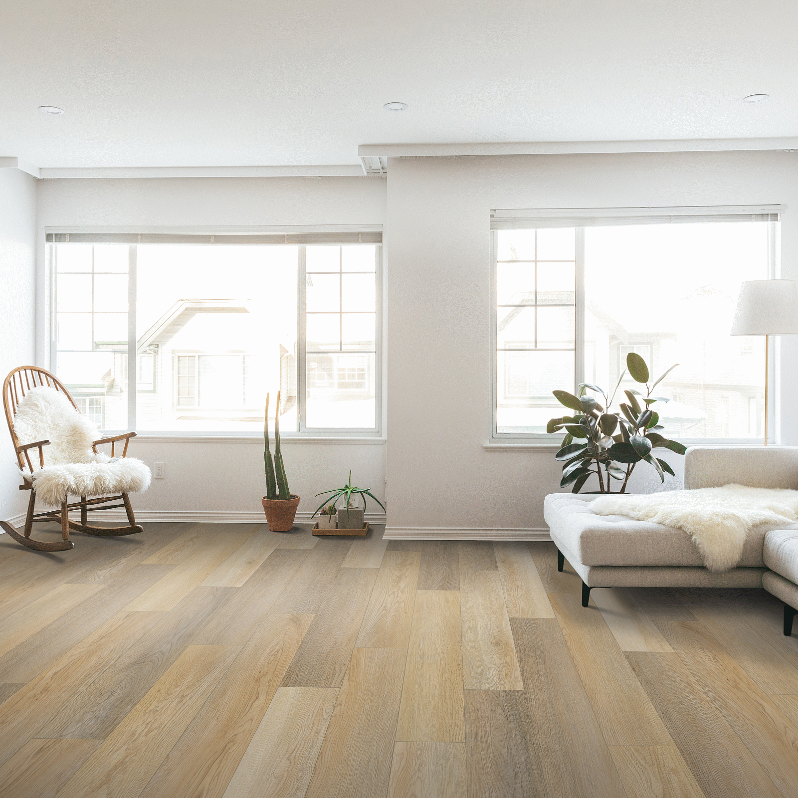 A living room with white walls and wooden floors.
