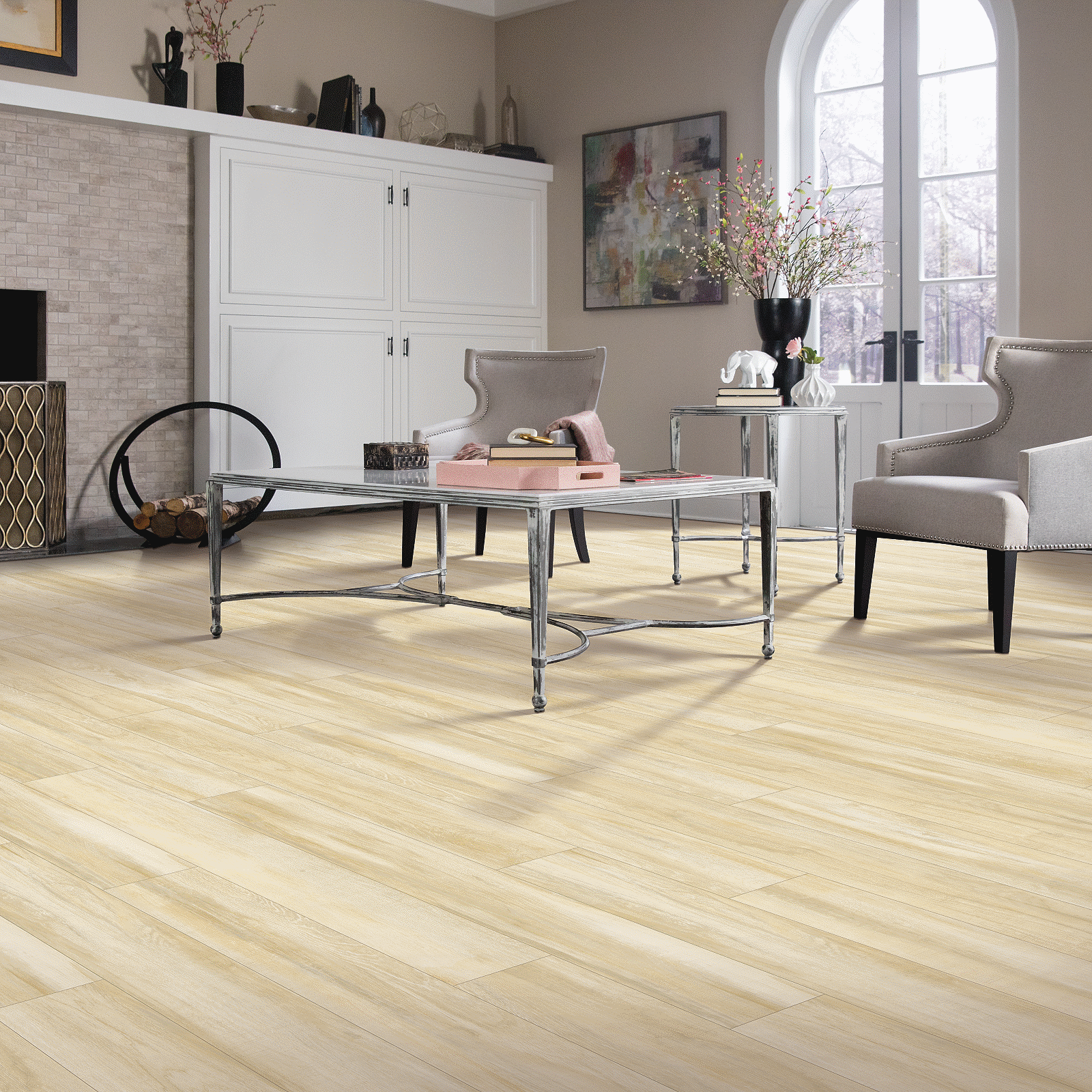 A living room with chairs and tables in it