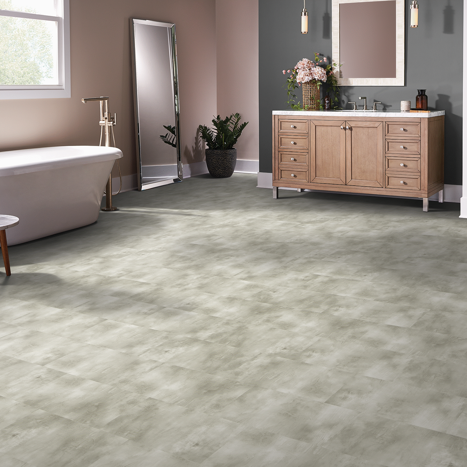 A bathroom with a sink, toilet and mirror.