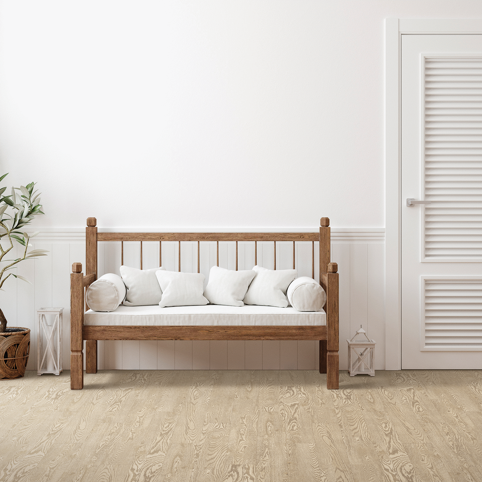 A wooden bench with pillows in front of a white wall.