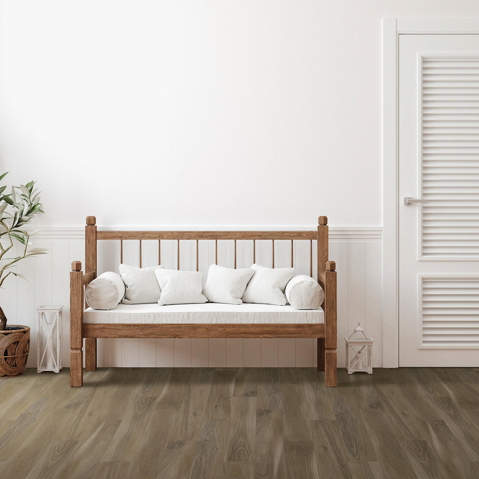 A wooden bench with pillows in front of a white door.