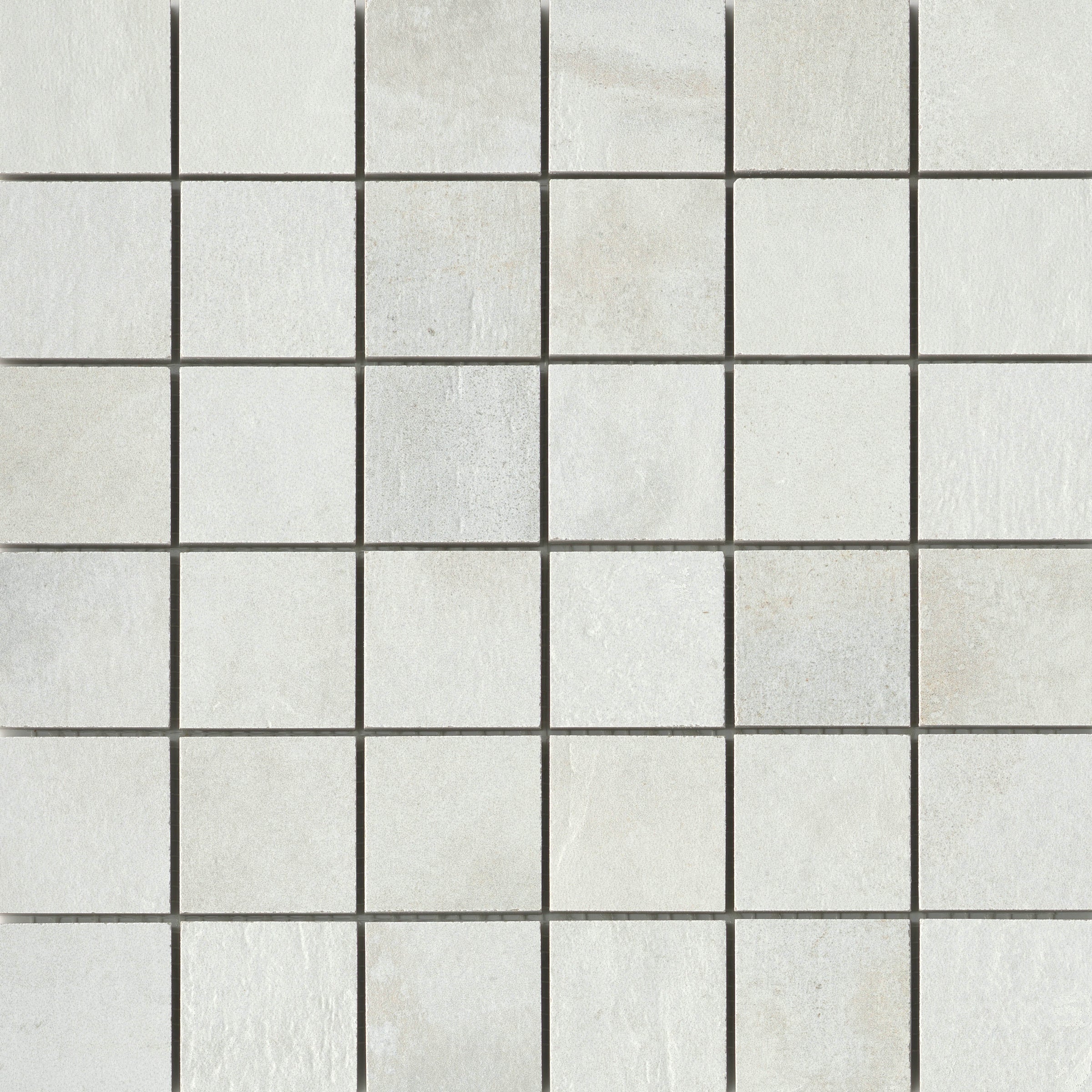 A white tile floor with some small squares