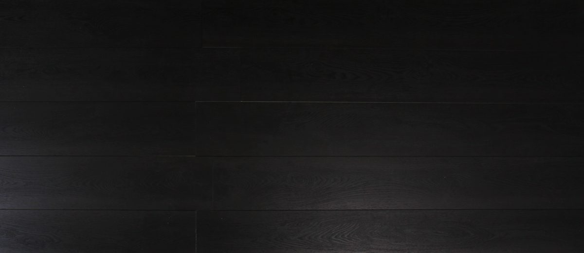 A black background with some type of wood