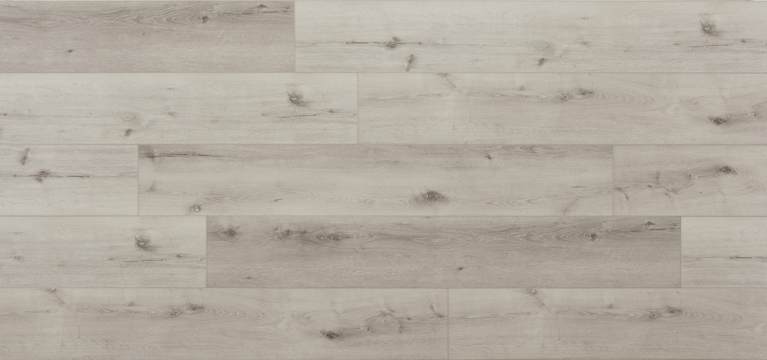 A white wood floor with some brown lines