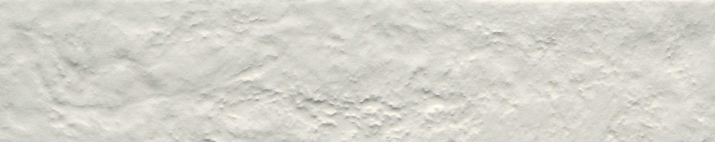 A white wall with some type of substance on it