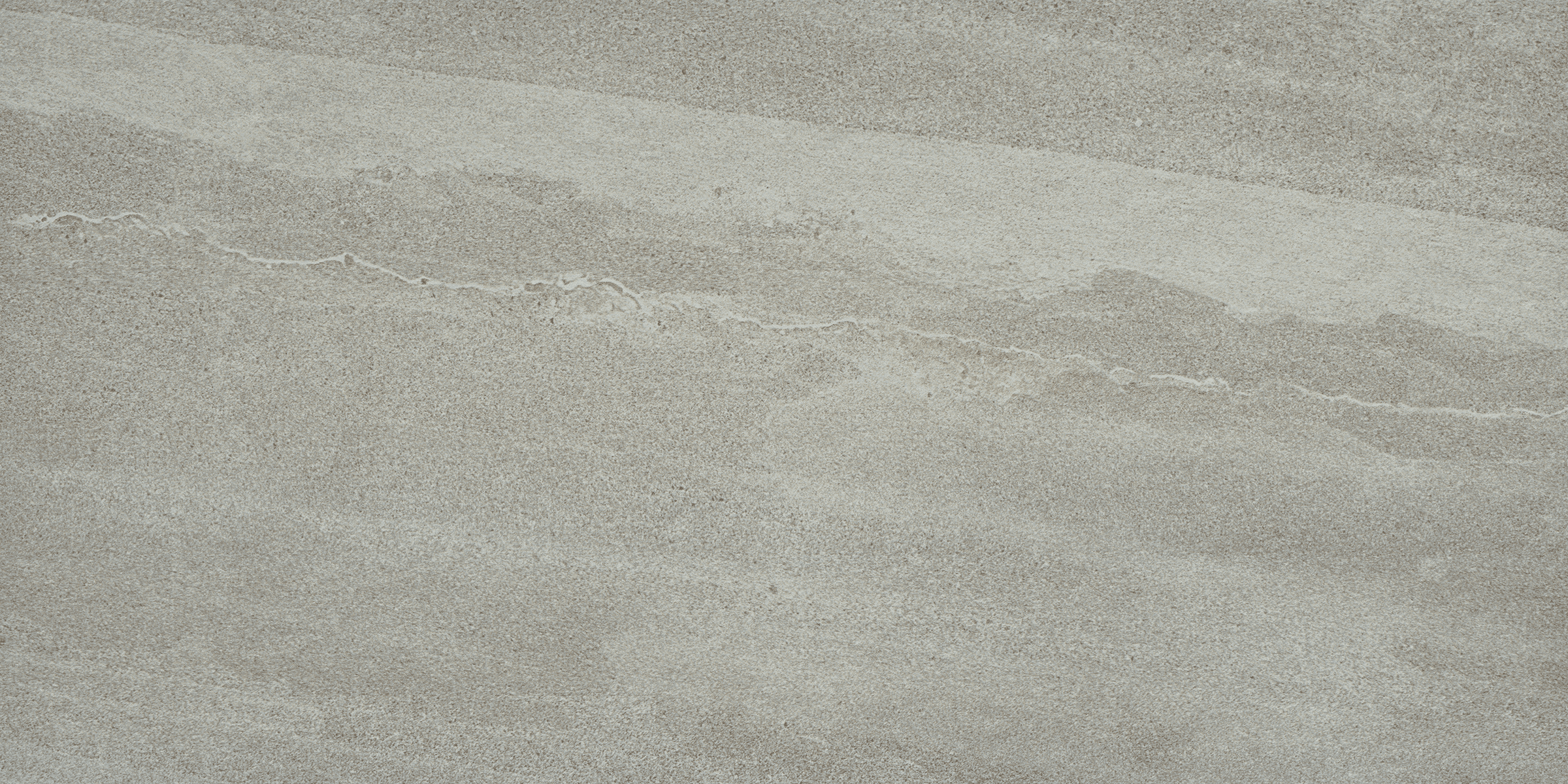 A gray sky with some clouds and a bird flying