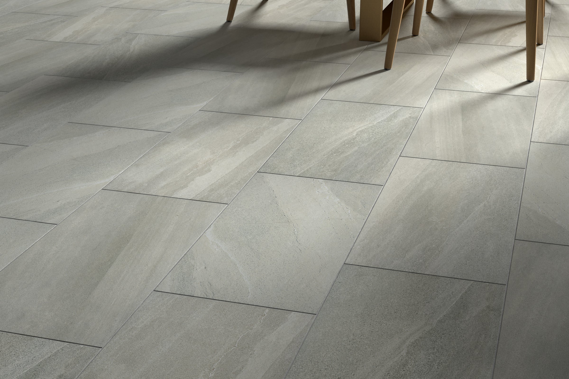 A tile floor with some shadows on it