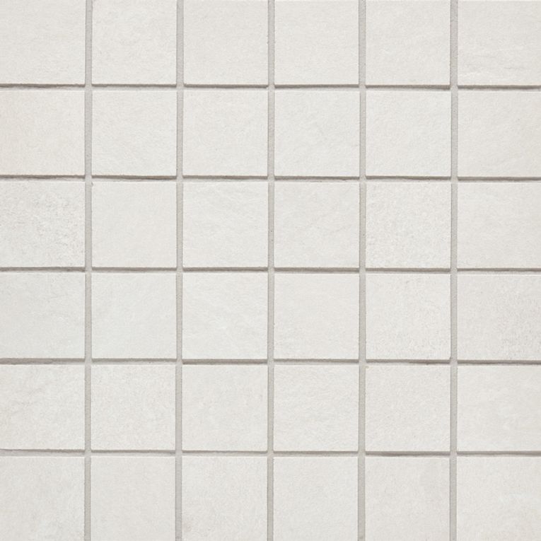 A white tile floor with some small squares