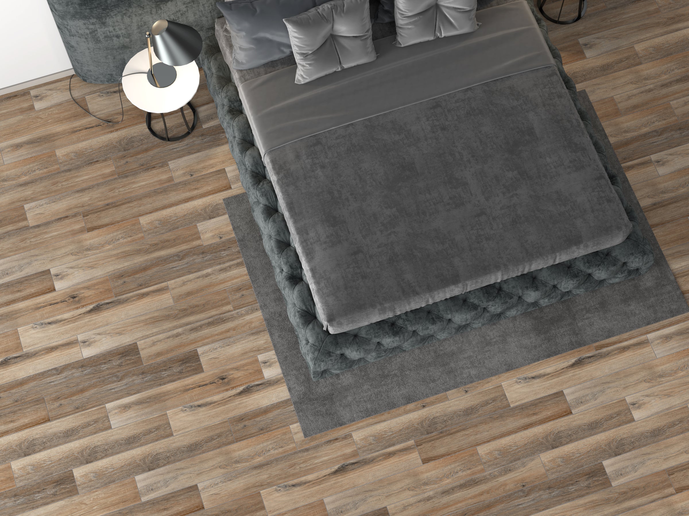 A bed room with two pillows and a rug