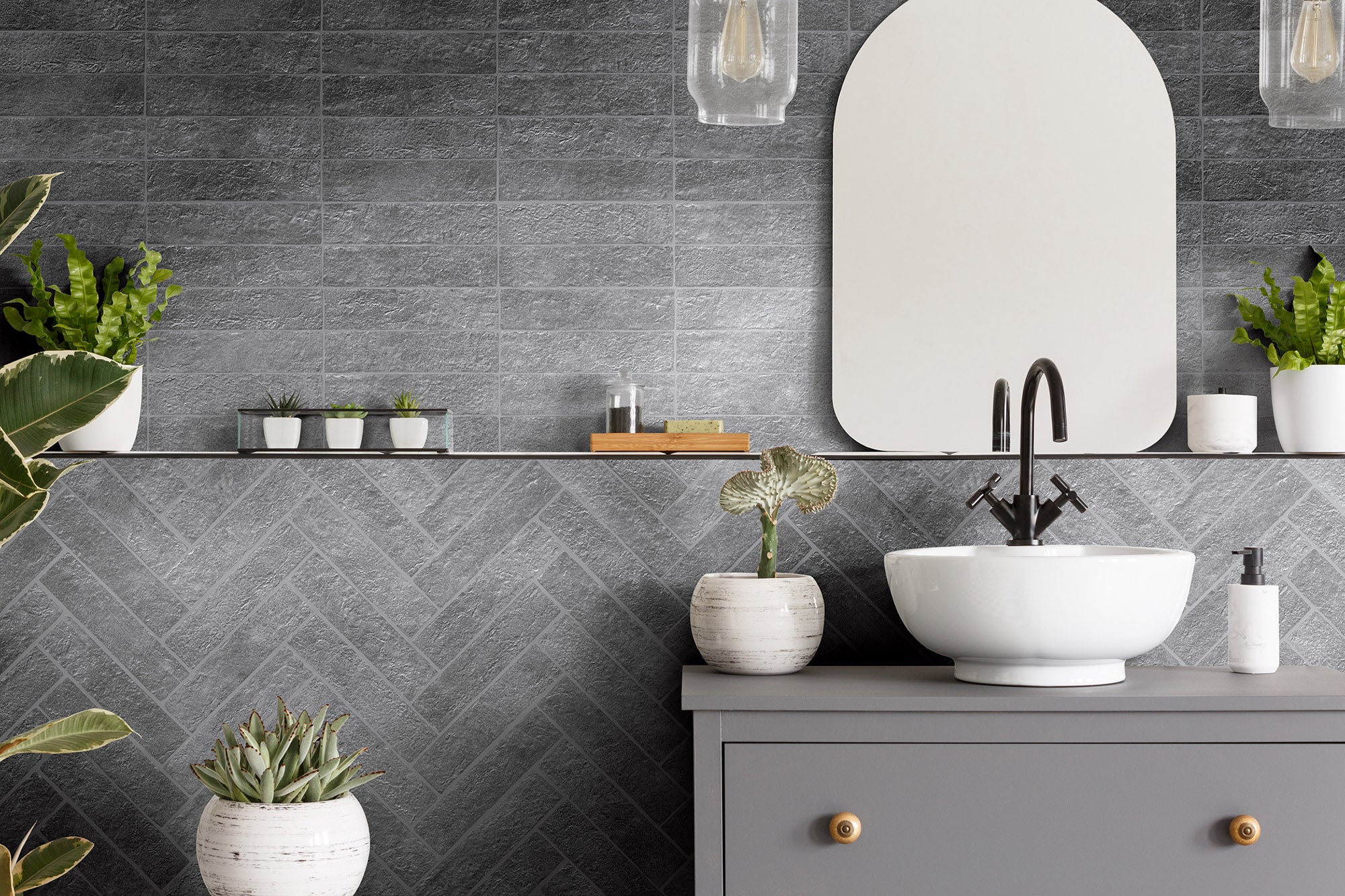 A bathroom with a sink and mirror in it