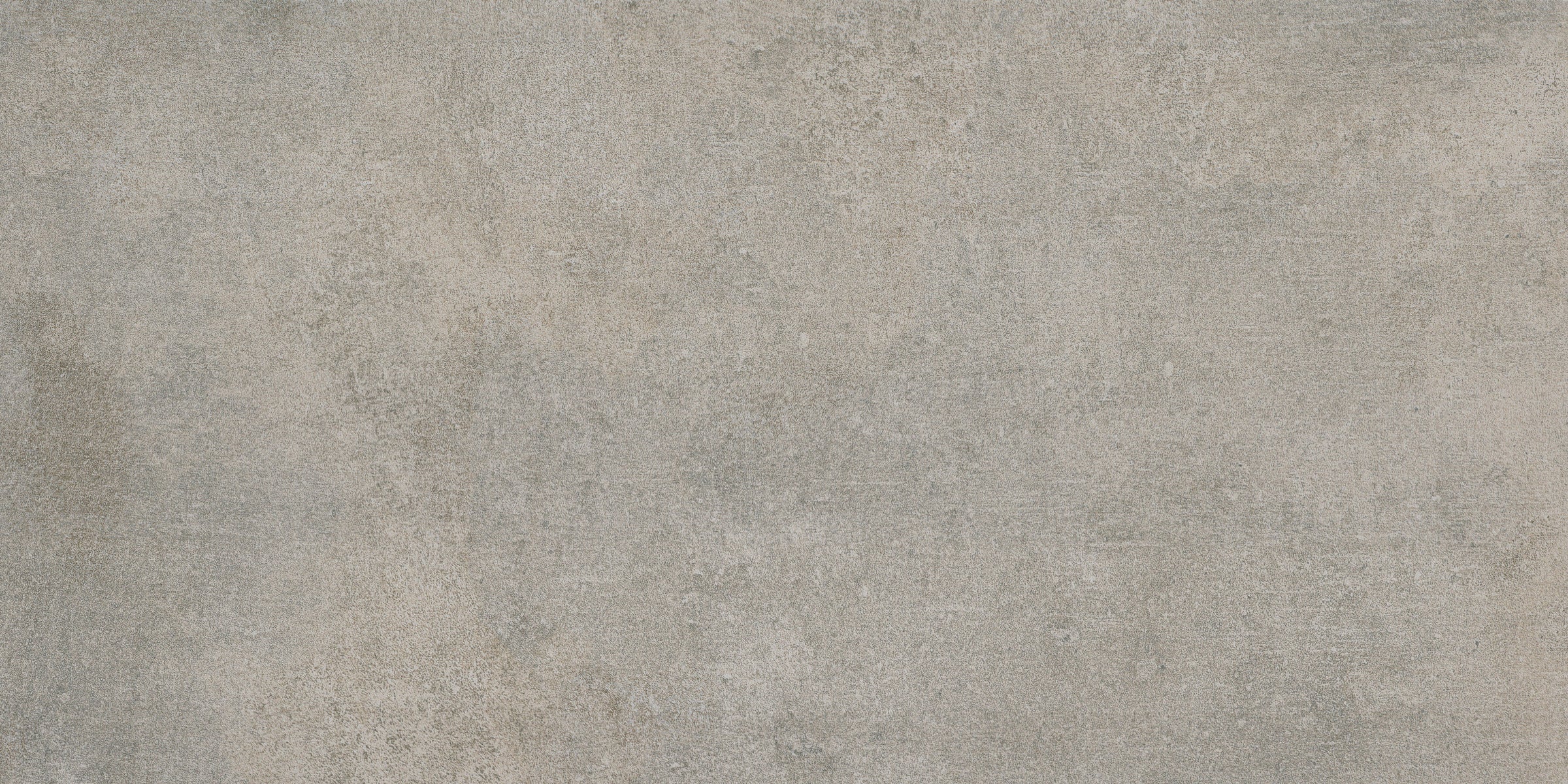 A gray concrete floor with some white spots