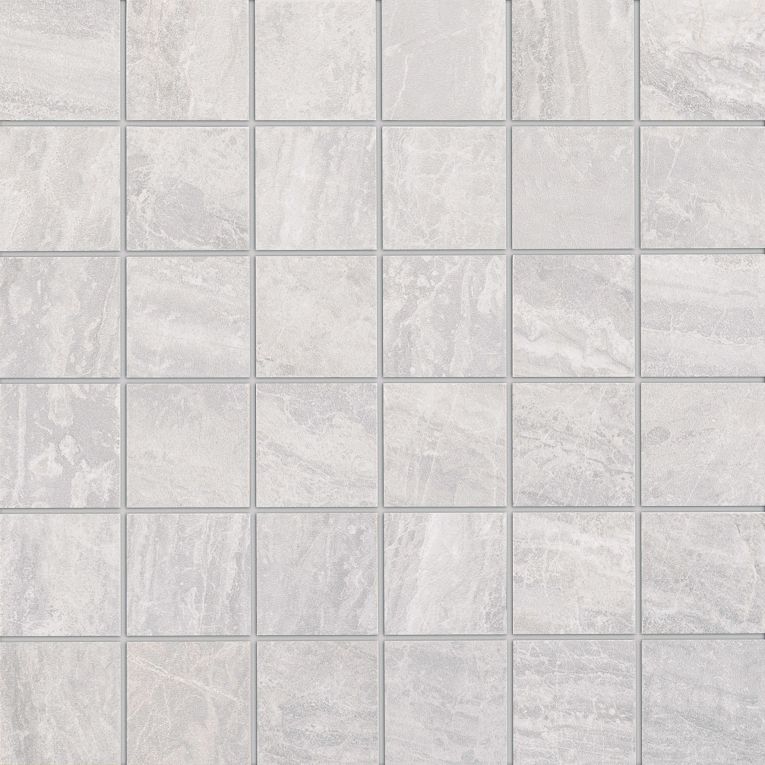 A white tile floor with some small squares