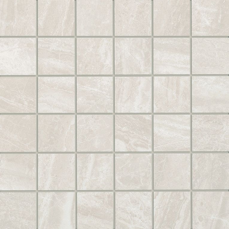 A white tile floor with some small squares