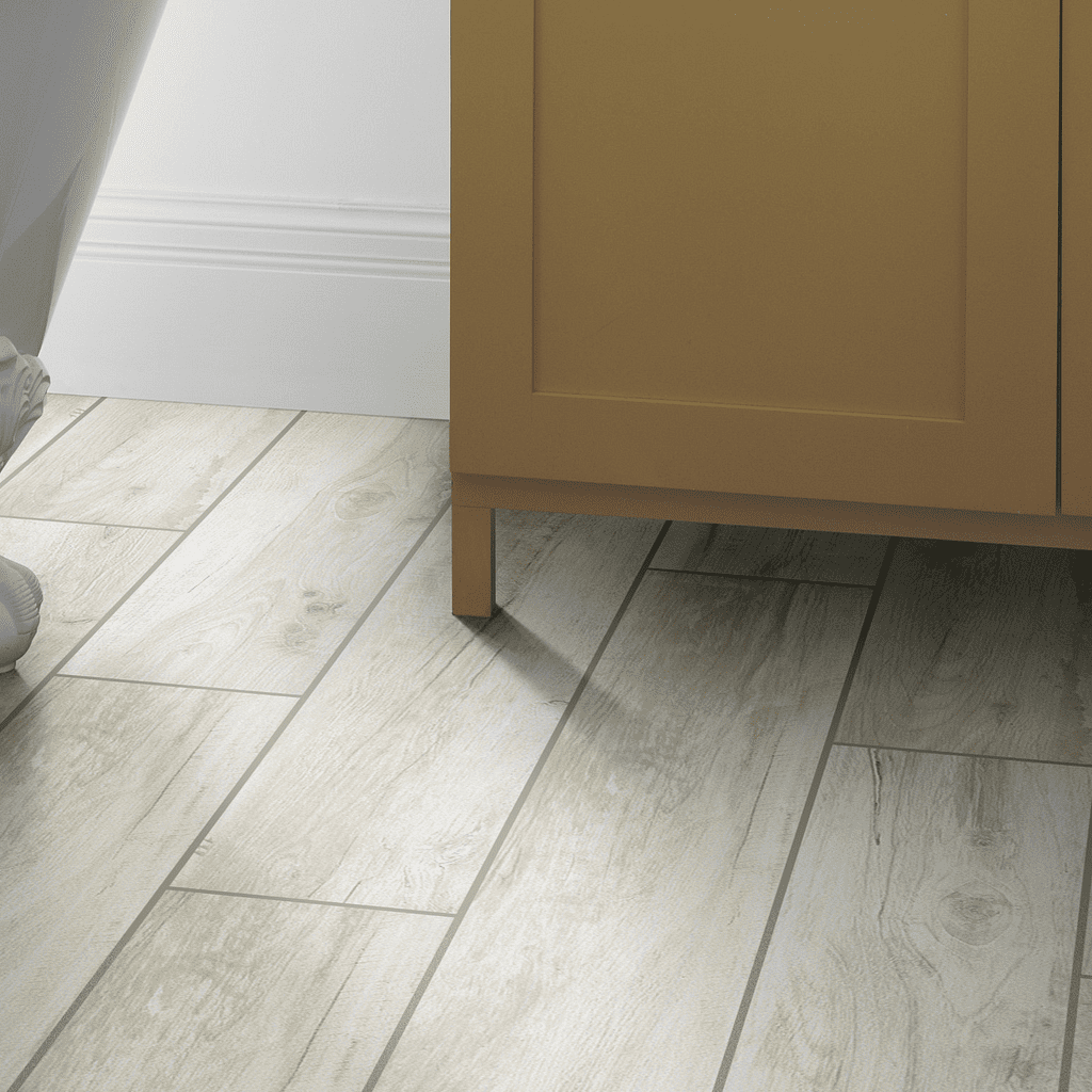 A person standing in front of a bathroom sink.