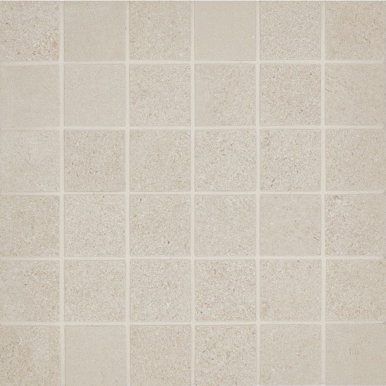 A white tile floor with some small squares
