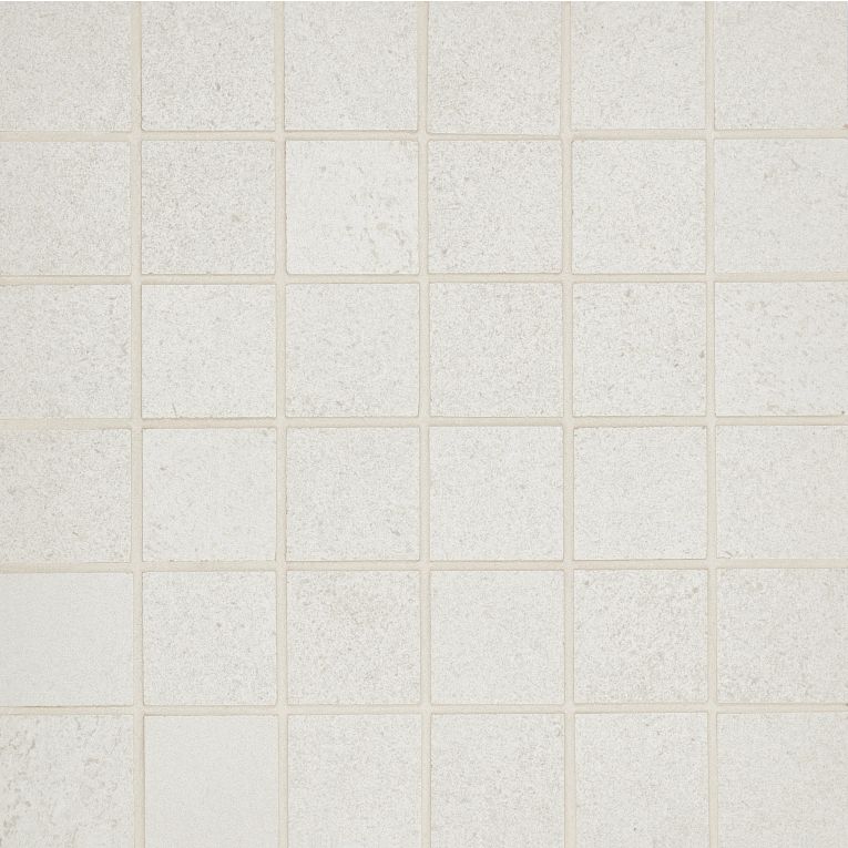 A white tile floor with some small squares