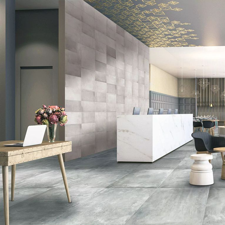 A room with a desk and a laptop on it